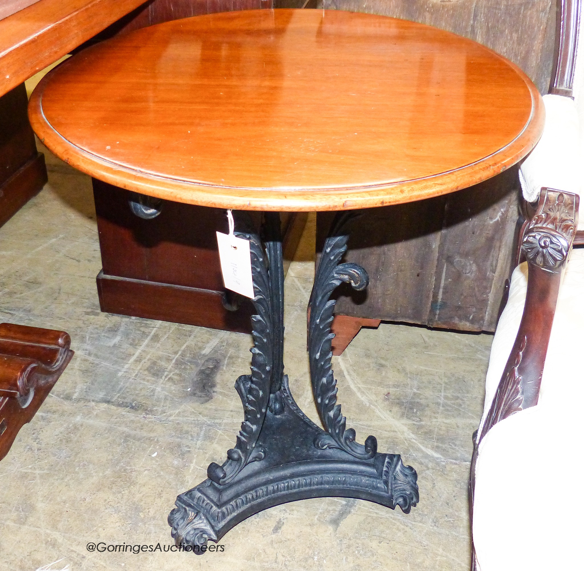 A Victorian style cast metal circular mahogany occasional table, diameter 59cm, height 70cm